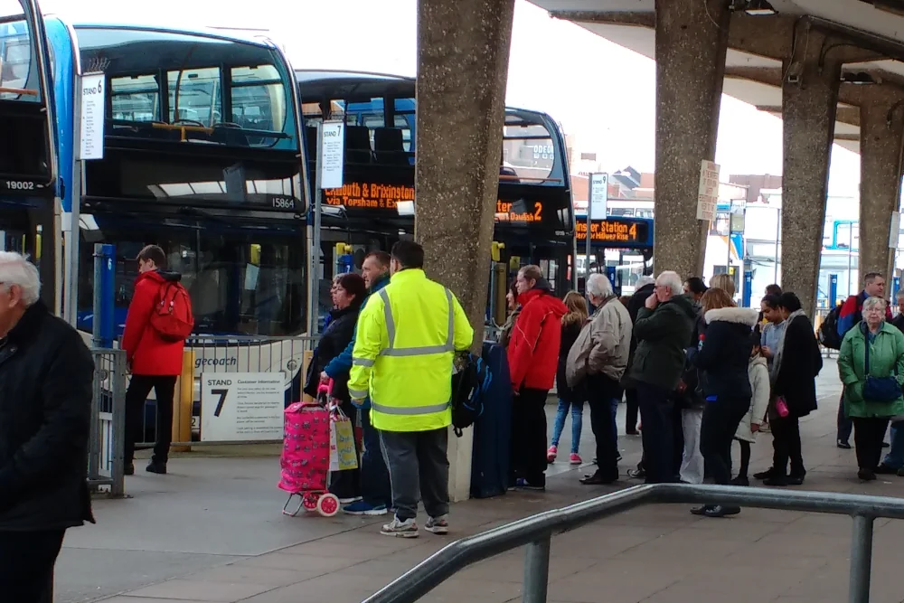 Passengers waiting to board bus