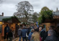 Exeter Christmas Market on Cathedral Green with festive stalls and lights