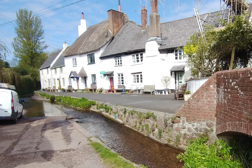 College Lane in Ide with cottages, stream and ford on Exeter circular walk