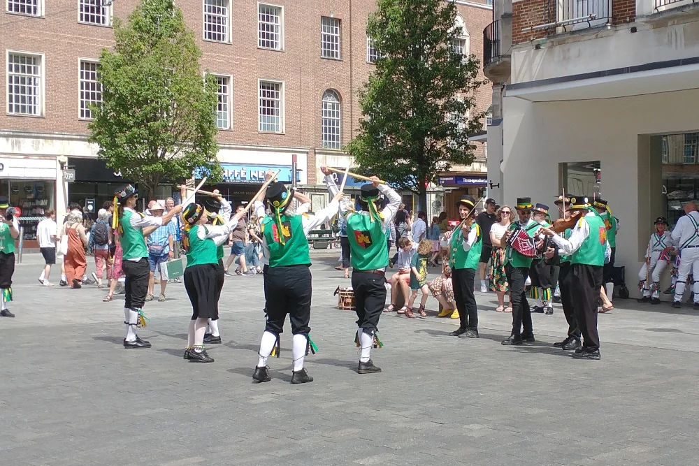 Traditional Morris dancing bringing celebration to Exeter just off the main High Street