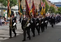 Veterans carrying standards during Exeter Armed Forces Day Parade 2026
