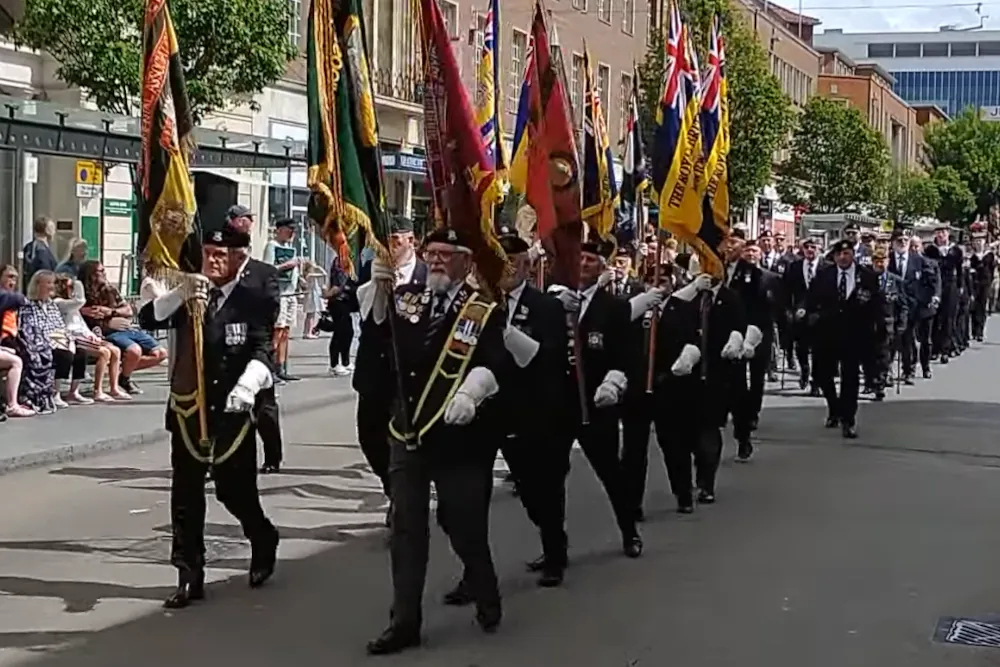 Veterans carrying standards during Exeter Armed Forces Day Parade 2026